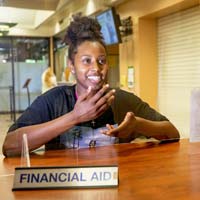 student at financial aid front desk