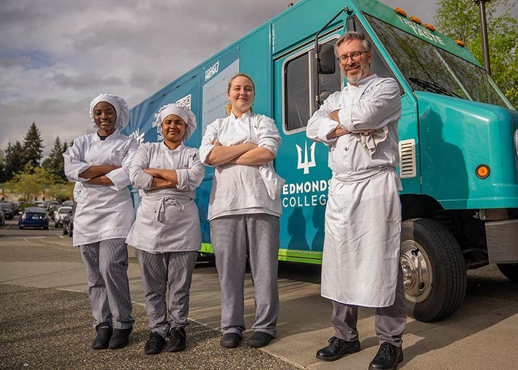 Culinary arts students near the food truck students