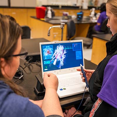 students looking at the computer