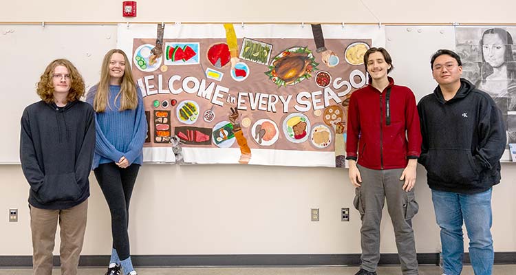 Art students with mural