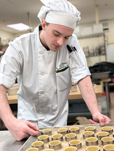 Collin trimming tartlet shells, Edmonds College Baking & Pastry Arts