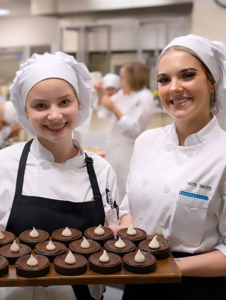 Olivia and Faith with chocolate espresso tarts, Edmonds College Baking & Pastry Arts