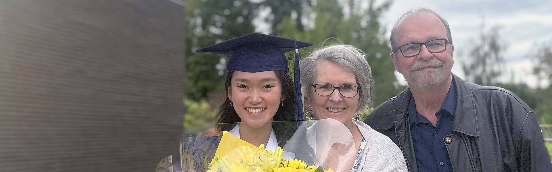 Host family with a student at graduation